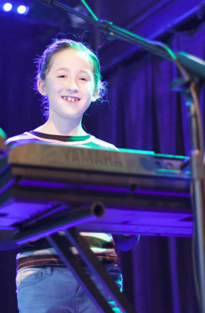 Girl playing Piano/Keyboard