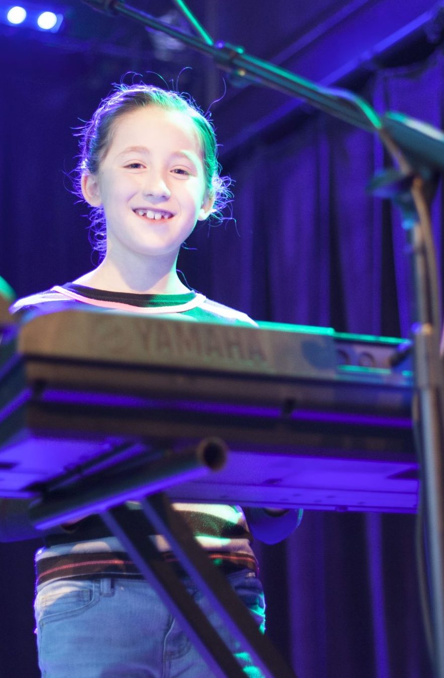 Girl playing Piano/Keyboard